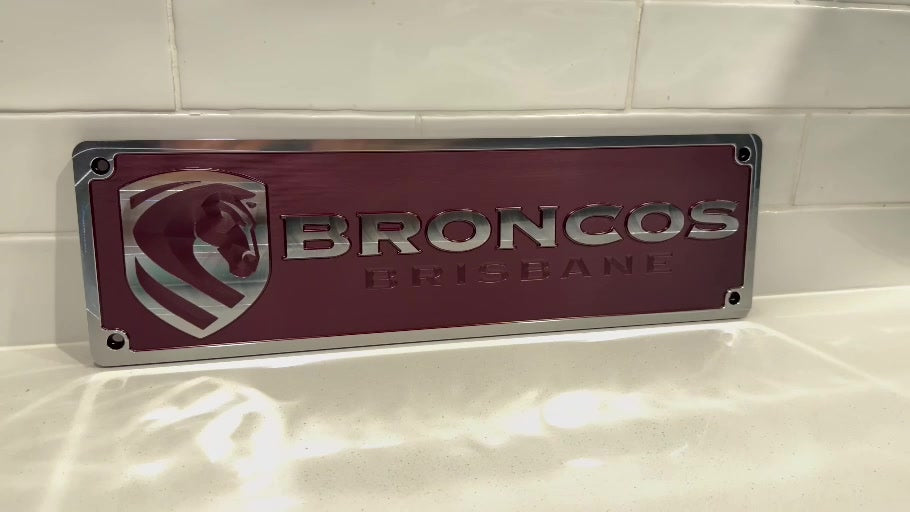 Brisbane Broncos machined supporter plate — anodised with post-machined highlights