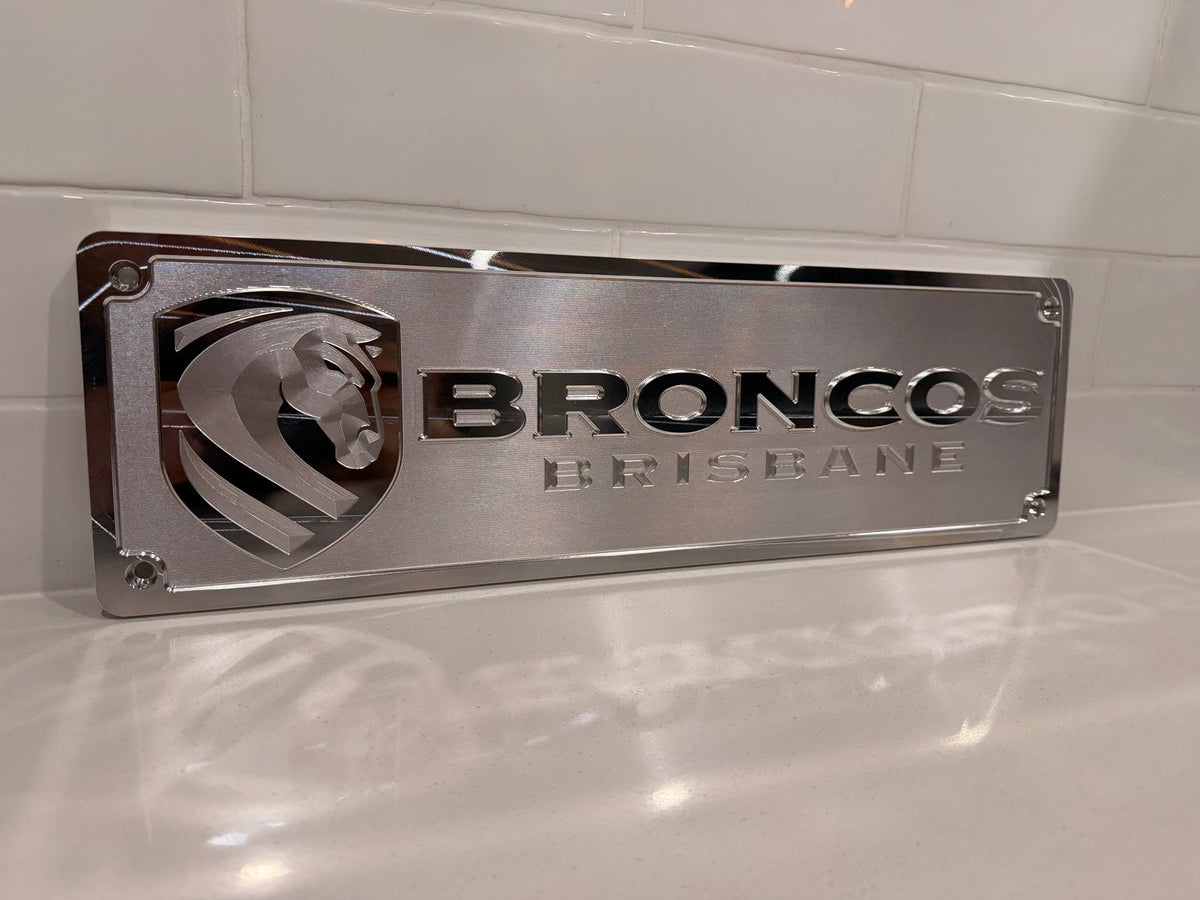 Brisbane Broncos machined supporter plate — raw machined aluminium
