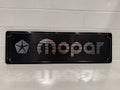 Mopar CNC machined display plate — black anodised with machined highlights