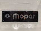 Mopar CNC machined display plate — black anodised with machined highlights